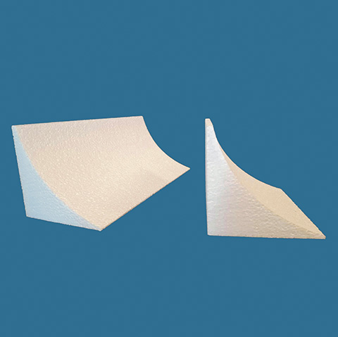 Two foam wedges on a blue background for use in various applications.