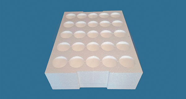 white foam tray with circular cutouts for holding up to nine items in a neat arrangement